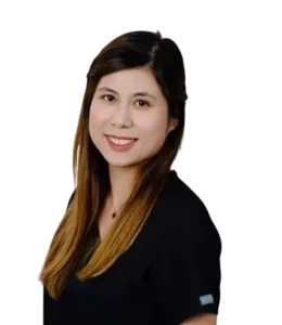 Headshot of Natalie I., Office Manager at AsterSmiles, smiling and wearing black scrubs.